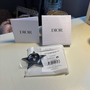 Authentic Dior Star-Shaped Phone Ring in Silver.